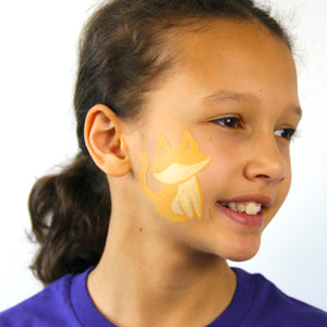 Step one, showing the start of creating cat base using bright orange and pale yellow face paint.