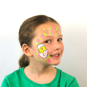 Final step, using lime green, pale pink, and pale yellow to create flowers and leaves around the chick to complete the Easter Chick face paint.