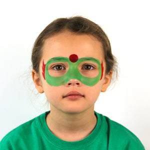 Step one, using grass green paint, draw mask shape around eyes. Then paint a circle in the middle of the forehead and feathers on the side of the mask using bright red paint.