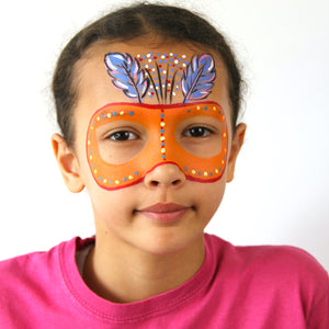 Final step show a face paint of orange Carnival Mask around eyes.