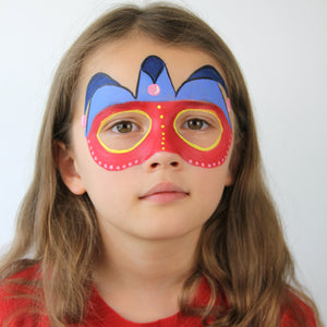 Final step show a face paint of Red Carnival Mask around eyes with yellow highlights.