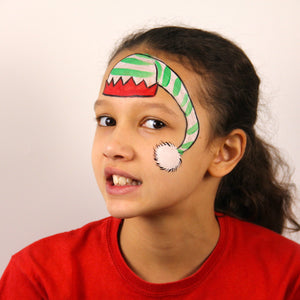 Step 2, paint a black outline around each part of the hat and then add green stripes to the white part of the hat, but not the bobble