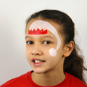 Step 1, to start your Elf, paint the hat on the forehead using red and white paint and don't forget the bobble at the end!