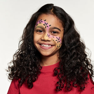 Step two, adding flower petals along swirl using black face paint.