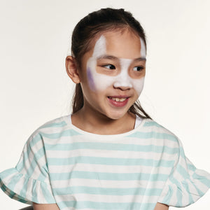 Step one, showing the start of creating pups face and ears using white face paint.