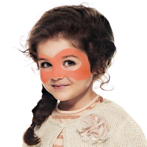 Step one, showing the start of creating pumpkin shaped mask around eyes using orange face paint.
