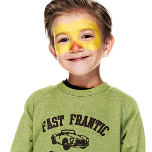 Step one, Painting a yellow mask with a ragged edge along the top, then painting an orange triangle with slightly curved edges on the nose.