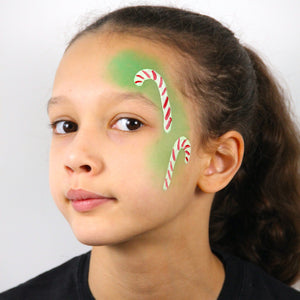 Step 2, paint two candy canes in white and then add lines on both, in red paint, so they look like candy canes