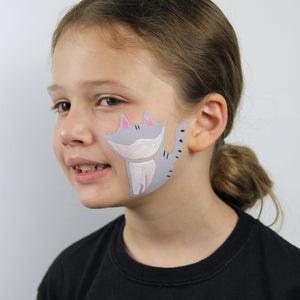 Step one, showing the start of creating cat base using white and grey face paint.