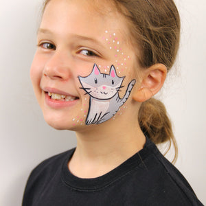 Final step, adding pink and white dots around design to complete Grey Cat face paint.